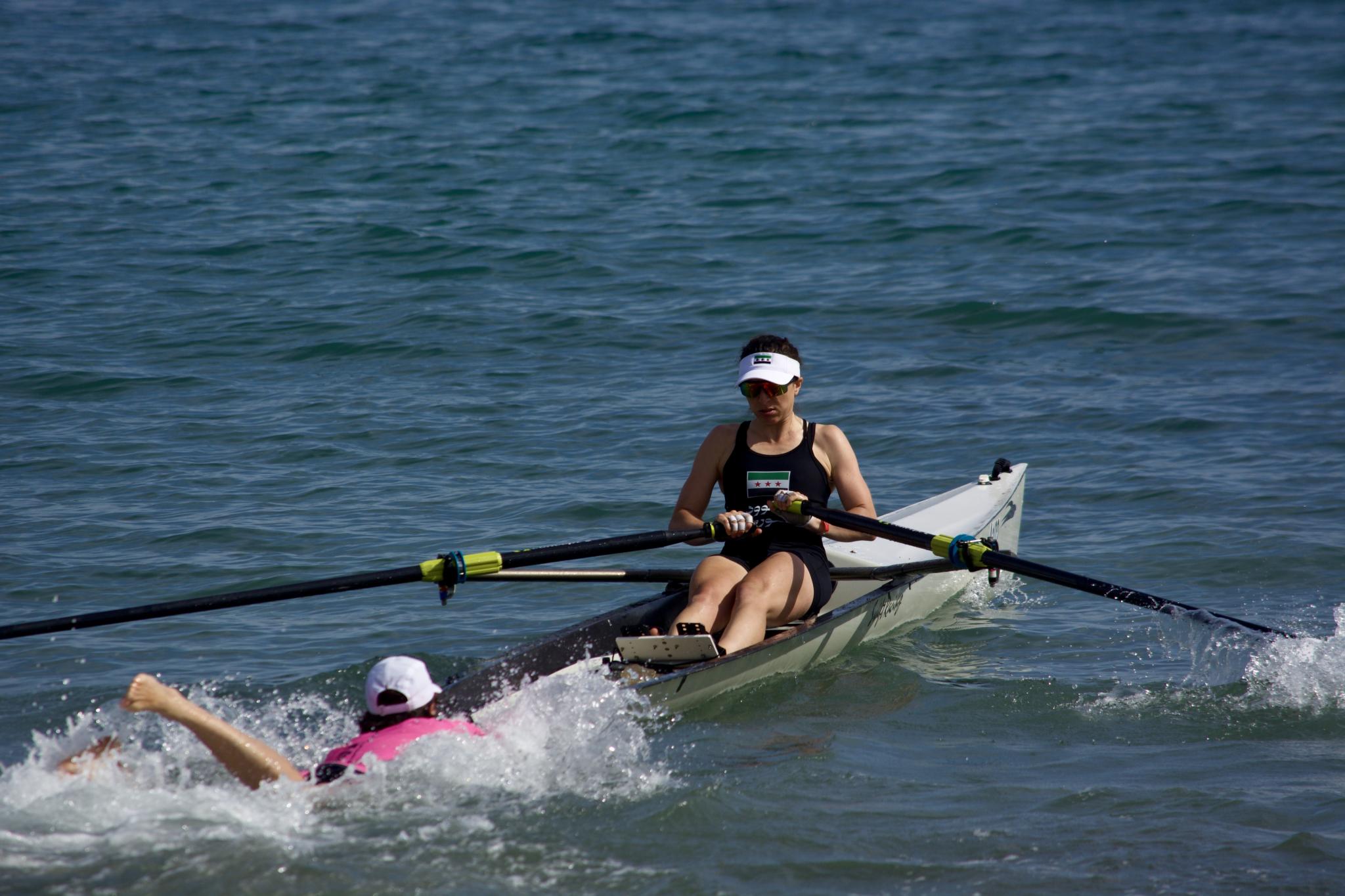 woman rowing at beach sprint event